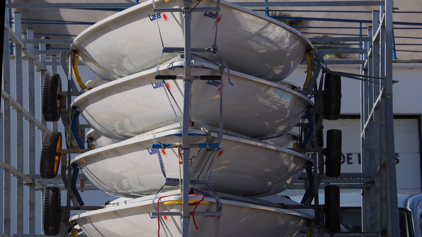 Side-by-side view of air-cooled mining hardware and an immersion cooling tank in a workshop setting
